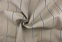 Load image into Gallery viewer, This fabric features a stripe design in beige, black and white. 

