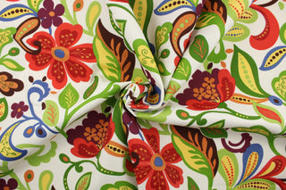 This colorful, multi use fabric features a large floral design in red, orange, blue, green, yellow and purple on a white background.  It is perfect for outdoor settings or indoors in a sunny room.  It is stain and water resistant and can withstand up to 500 hours of direct sun exposure and has a durability rating of 10,000 double rubs.  Uses include decorative pillows, cushions, chair pads, tote bags and upholstery.