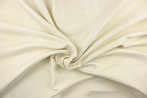  This sheer fabric features a wide stripe design in a creamy white