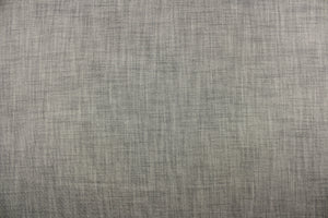 This wide jacquard fabric features a twill look in a gray and black .