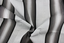 Load image into Gallery viewer,  This fabric features a stripe design in varying shades of gray with black.

