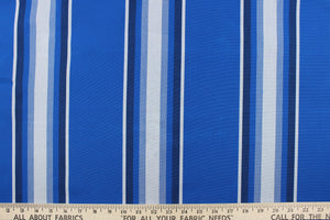 This fabric features a stripe design  in varying shades of blue with white.
