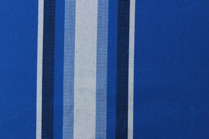 This fabric features a stripe design  in varying shades of blue with white.