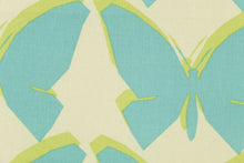 Load image into Gallery viewer, Chambord features screen printed butterflies and their silhouettes in aqua, cream and lime.  It is perfect for window treatments, headboards, bedding, decorative pillows and light duty upholstery applications.  This fabric has a soft workable feel yet is stable and durable with 30,000 double rubs.  
