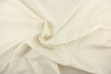 Load image into Gallery viewer,  This sheer fabric features a geometric circular design in off white
