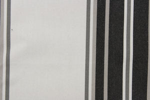 This  fabric features a stripe design in varying shades of gray from pale gray to dark almost black gray.