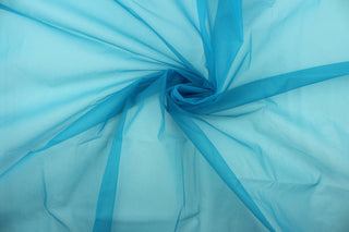 A sheer, semi firm, netting tulle in teal .
