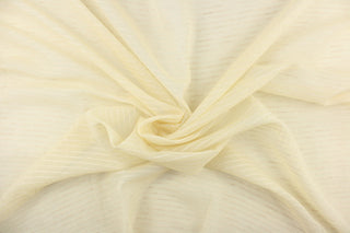 This sheer fabric features a thin stripe design in a pale yellow or cream.
