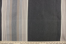 Load image into Gallery viewer, This fabric features a stripe design in gray, taupe, pale beige, dark gray and brown.
