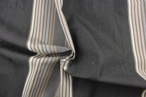 This fabric features a stripe design in gray, taupe, pale beige, dark gray and brown.