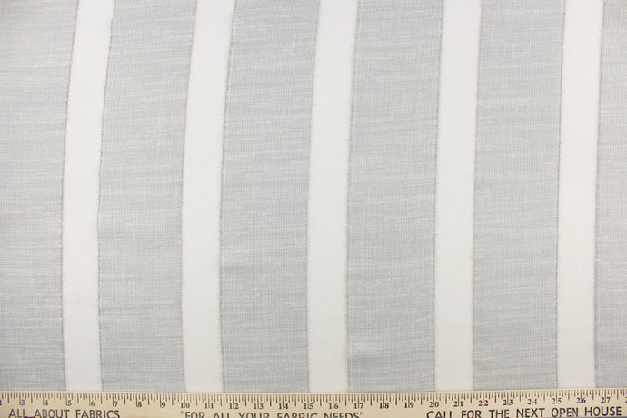  This sheer fabric features a  stripe design in a  ight gray .