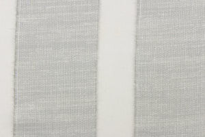  This sheer fabric features a  stripe design in a  ight gray .