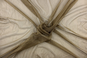 A sheer fabric featuring a net look in golden tan .