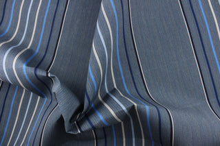 This fabric features a stripe design in varying shades of blue, gray, and black. 