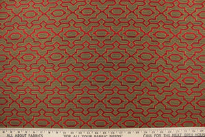 This fabric features a geometric pattern in dark red on a black/gold background.   It is durable and hard wearing and would be great for multi-purpose upholstery, bedding, cornice boards, accent pillows and drapery.  