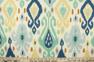  This fabric features an Ikat design in blue, turquoise, off white, tan, and rust orange.