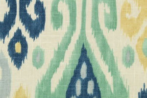  This fabric features an Ikat design in blue, turquoise, off white, tan, and rust orange.