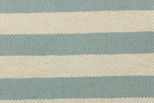 Load image into Gallery viewer, This striped high end upholstery weight fabric is suited for uses that requires a more durable fabric. The reinforced backing makes it great for upholstery projects including sofas, chairs, dining chairs, pillows, handbags and craft projects.  It is soft and pliable and would make a great accent to any room.  Colors included blue green and light beige.
