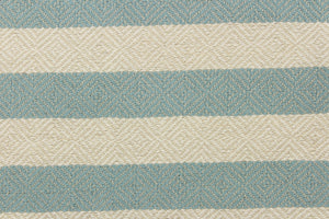 This striped high end upholstery weight fabric is suited for uses that requires a more durable fabric. The reinforced backing makes it great for upholstery projects including sofas, chairs, dining chairs, pillows, handbags and craft projects.  It is soft and pliable and would make a great accent to any room.  Colors included blue green and light beige.