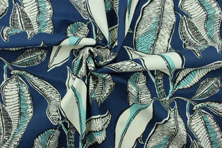 This fabric features a leaf design in dark blue, light turquoise, white, and black. 