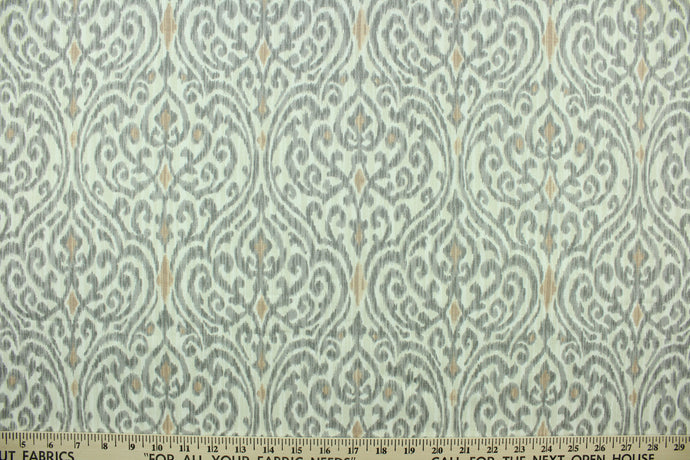 This fabric features a demask design in gray, dull white and nude.