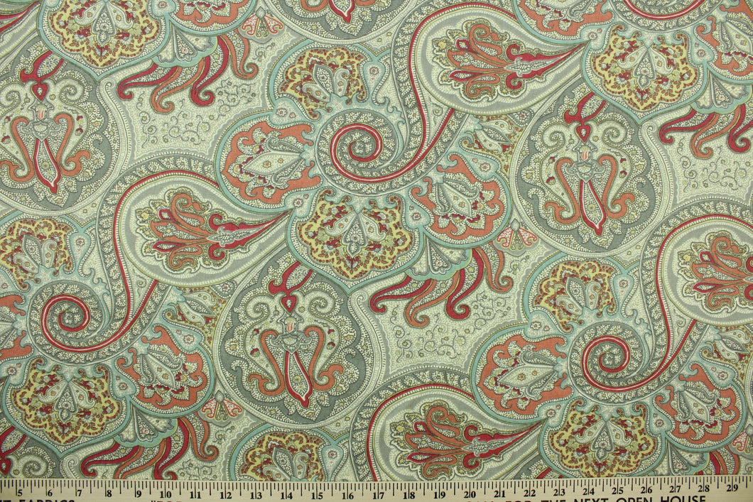  This fabric features a paisley design in light pink, dark pink, gray, pale yellow, light blue, and off white.