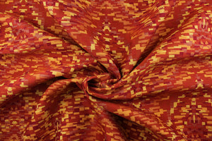 This fabric features varying shades of red, yellow and orange.   It is durable and hard wearing and would be great for multi-purpose upholstery, bedding, cornice boards, accent pillows and drapery.  