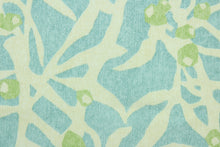 Load image into Gallery viewer,  This fabric features a branch design in light blue and light green against a off white. 
