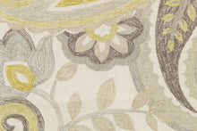 Load image into Gallery viewer, This fabric features a paisley design in gray, mustard yellow, light taupe set against a off white. 
