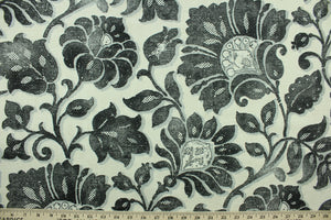 This fabric features a floral design in black, and gray against a pale beige. 