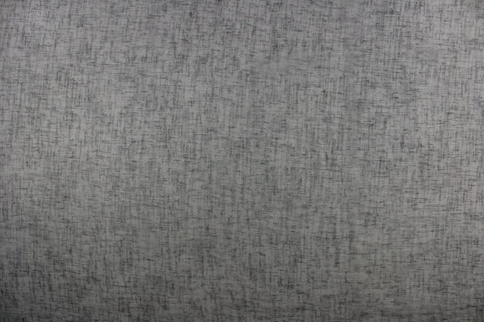 This sheer fabric in a solid dark gray . 