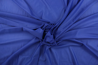 A sheer fabric  in a solid royal blue .