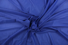 Load image into Gallery viewer, A sheer fabric  in a solid royal blue .

