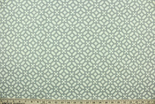 Load image into Gallery viewer,  This fabric features a lattice design in gray and white
