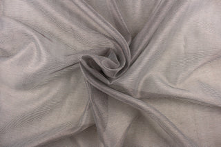This sheer fabric features a stripe design in brown against gray . 