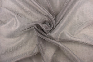 This sheer fabric features a stripe design in brown against gray . 