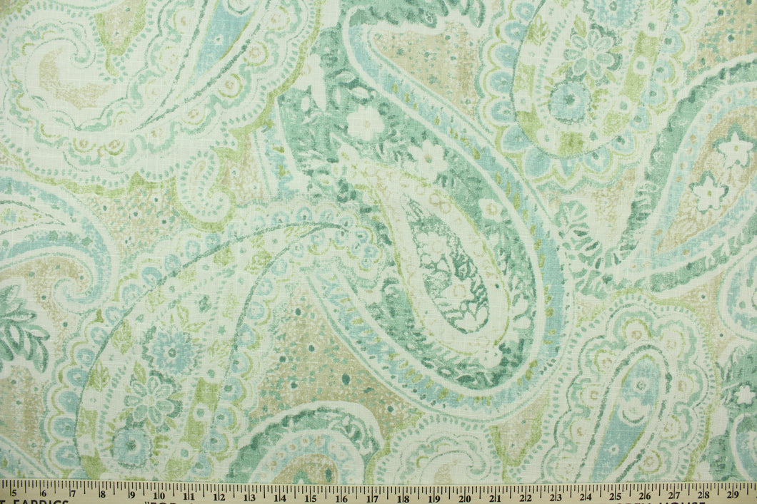 This fabric features a beautiful paisley design in seafoam green, beige, lime green, light blue, and white. 