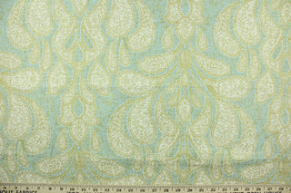  This fabric features a beautiful demask design in gold, and white against a light blue background.