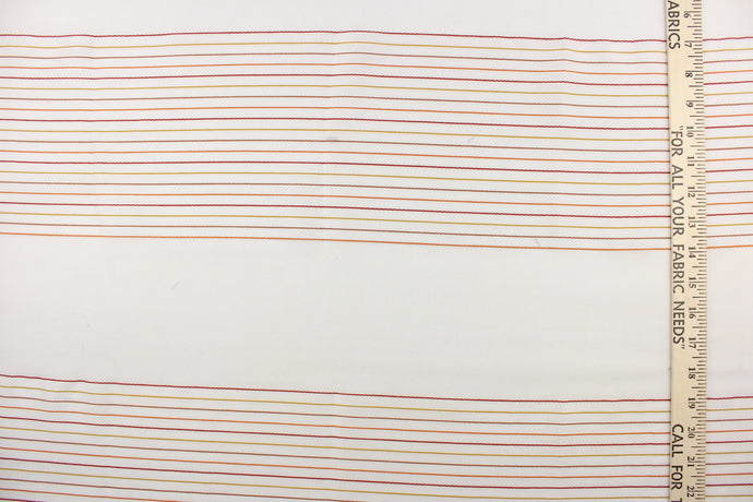 This sheer fabric features a stripe design in orange, brown, red, and golden yellow  against white. 