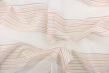 Load image into Gallery viewer, This sheer fabric features a stripe design in orange, brown, red, and golden yellow  against white. 
