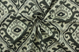 This fabric features a geometric design in varying shades of gray set against a off white background. 