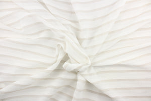 This sheer fabric features a stripe design in beige and white .