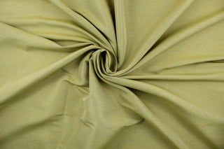 A mock linen in lime green with hints of blue and gold.