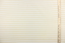 Load image into Gallery viewer, This sheer fabric features a stripe design in gold and cream . 
