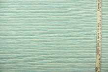 Load image into Gallery viewer, This fabric features brushstroke stripes design in a light blue set against a off white background . 
