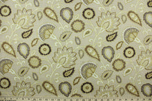 Load image into Gallery viewer,  This fabric features a floral design in brown, taupe, beige, and white outline in gold set against a light beige background.
