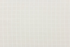 This sheer fabric features a checker design in a off white .
