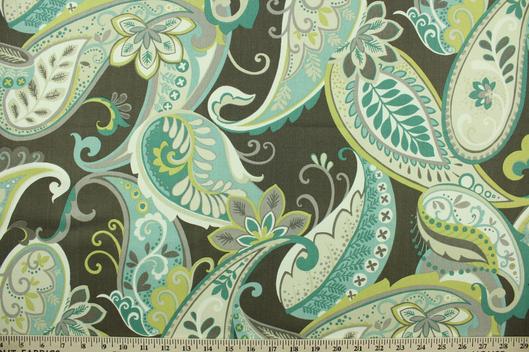 This fabric features a paisley design in brown, gray, white, lime green, turquoise, teal and pale beige. 