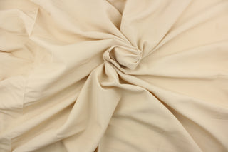  This sheer fabric features a design in a light khaki .
