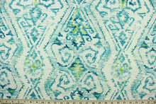 Load image into Gallery viewer,  This fabric features an Aztec design in turquoise, lime green and white. 

